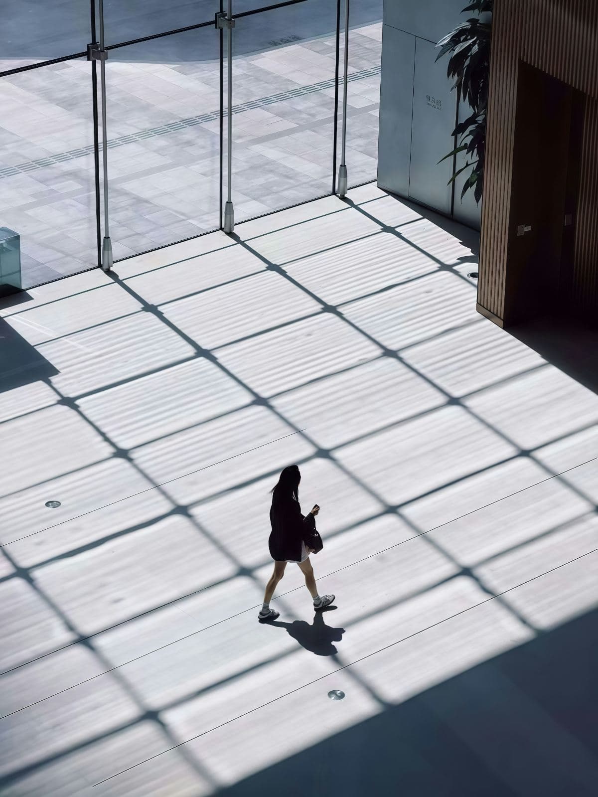 A person walking through a bright, spacious business center